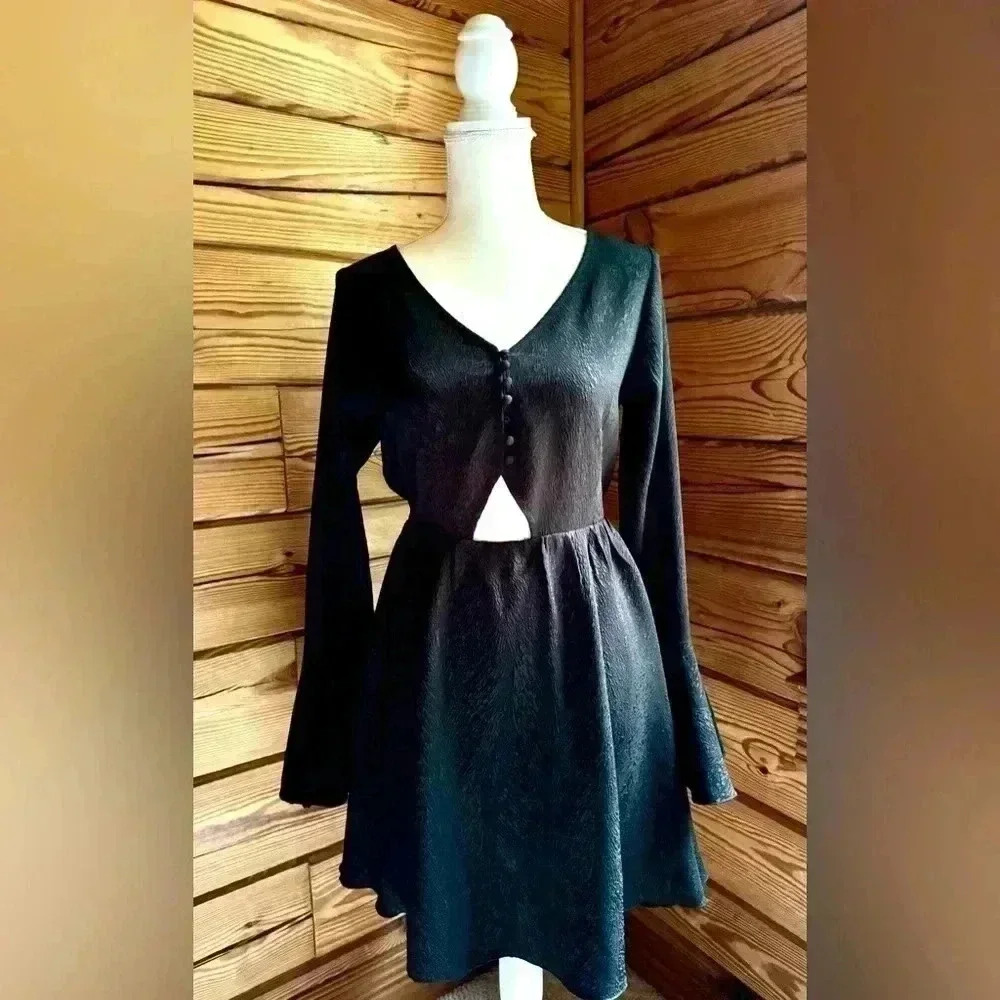 Whitney Eve Guava Dress Black with cutout, bell sleeve, & button front​